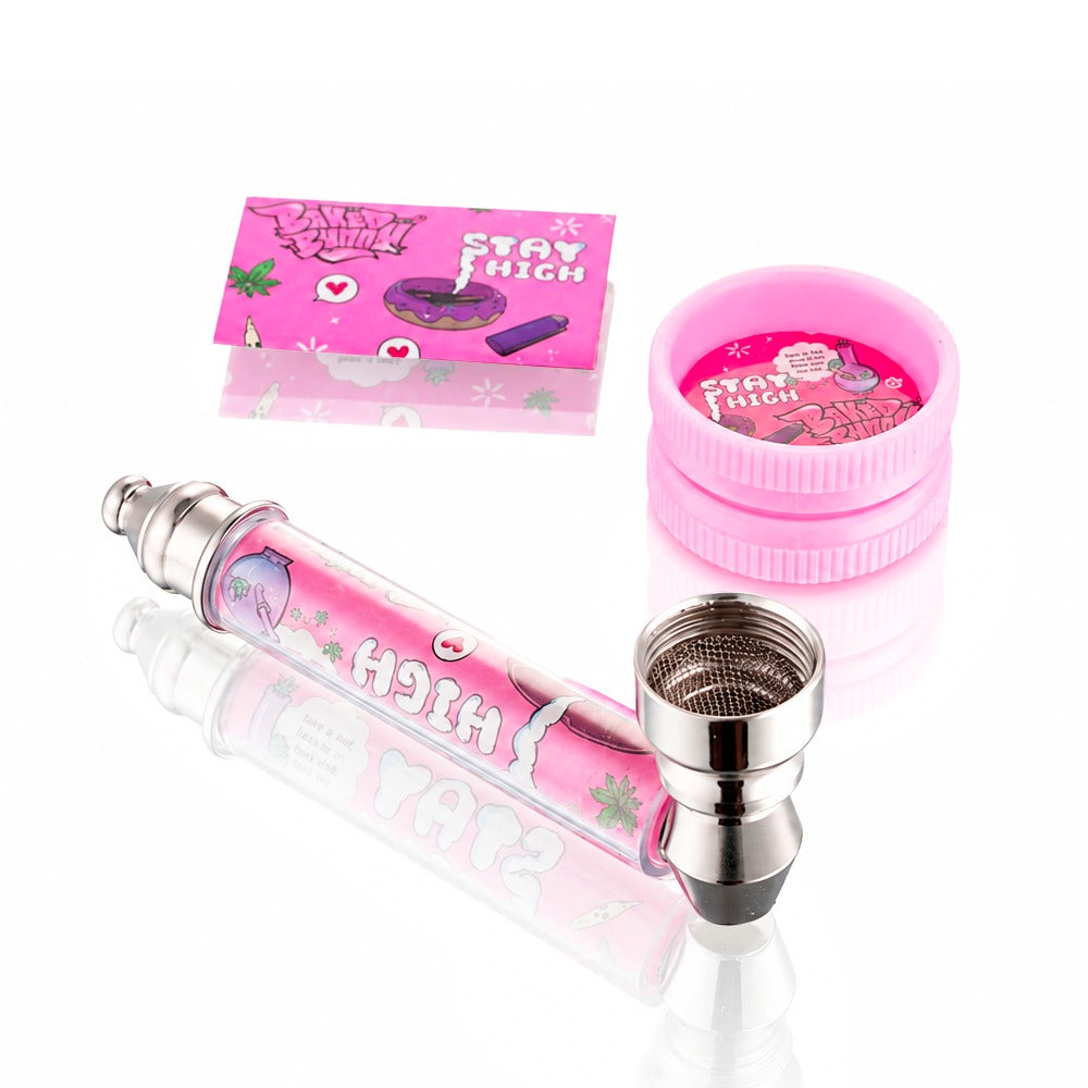 Baked Bunny Stay High pink pipe kit from Bong Warehouse, close-up of the glass pipe with grinder and papers behind