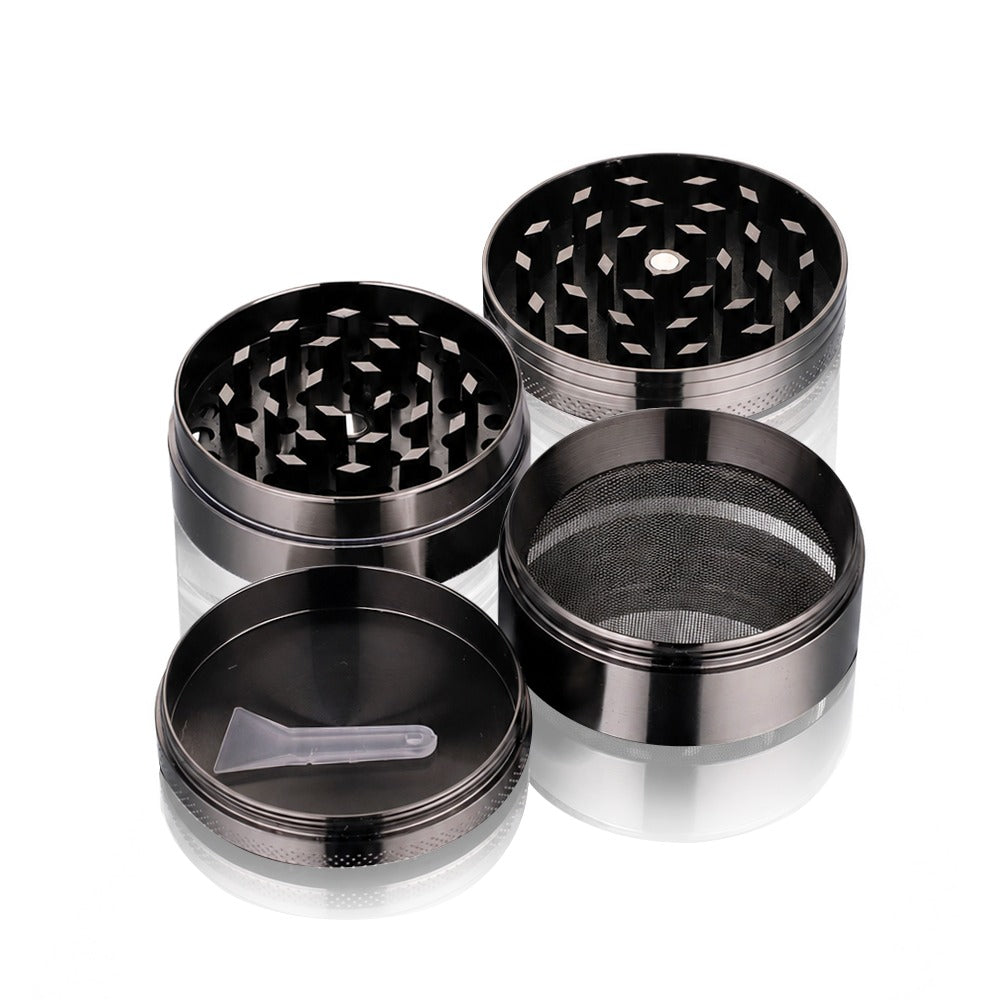Gunmetal grey 4-piece metal weed grinder from Bong Warehouse taken apart, all four pieces with the pollen scraper