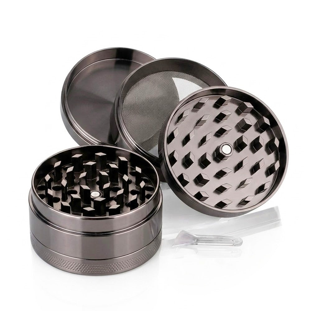 Close-up of the diamond-cut teeth and pollen screen on the gunmetal grey 4-piece metal weed grinder from Bong Warehouse