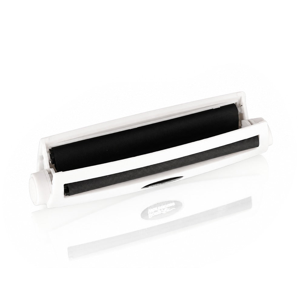 White king size 110mm plastic cigarette rolling machine from Bong Warehouse, shown open with the roller lid lifted and black rollers exposed