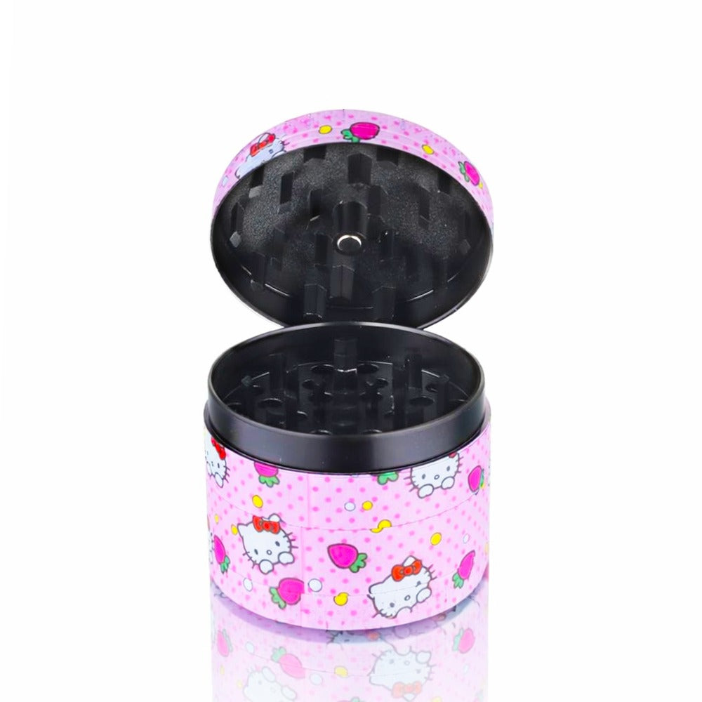 Front view of BW Pink Plastic Weed Grinder 50mm Round in Strawberry Kitty design on white background, clean studio product shot Opened Lid