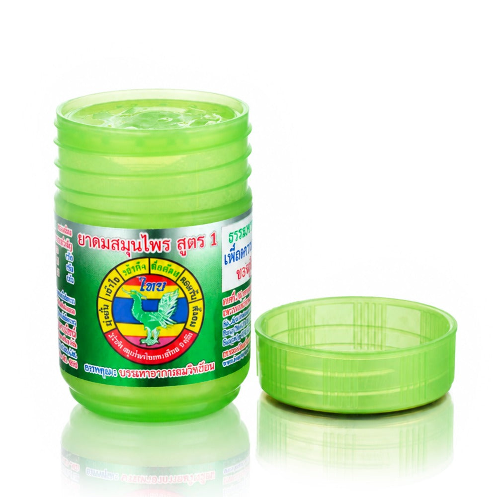 Hong Thai Yadom green herbal inhaler with lid removed showing the dried herbal compound inside