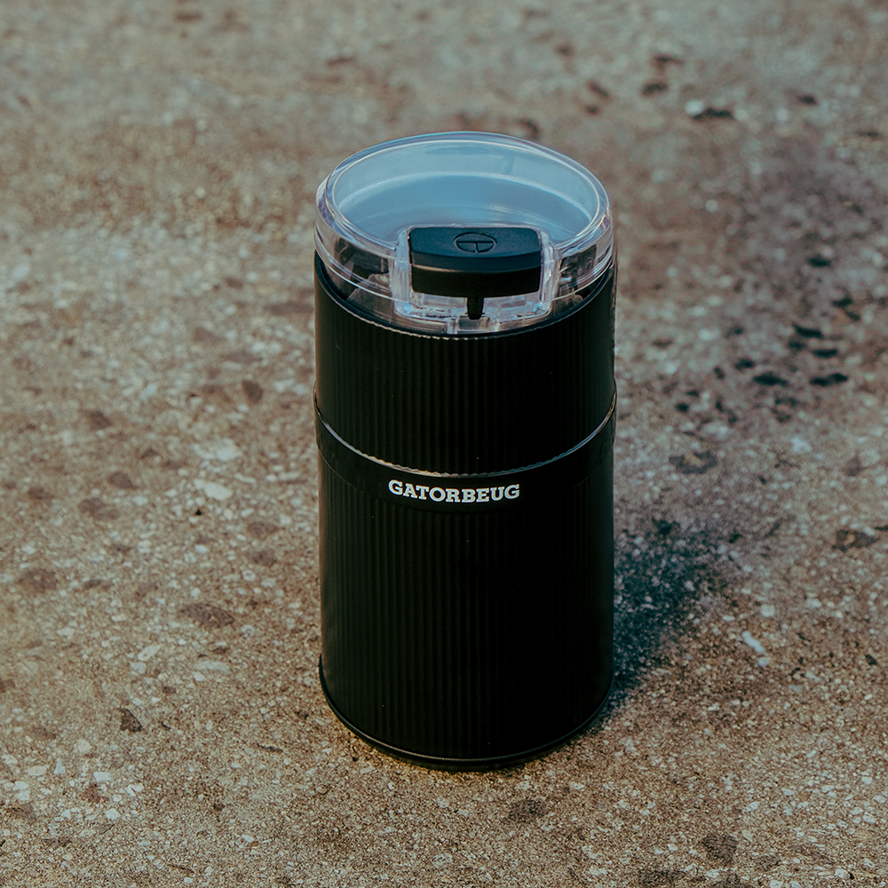 Gatorbeug Compact Electric Weed and Herb Grinder in Black with transparent lid on full top front view