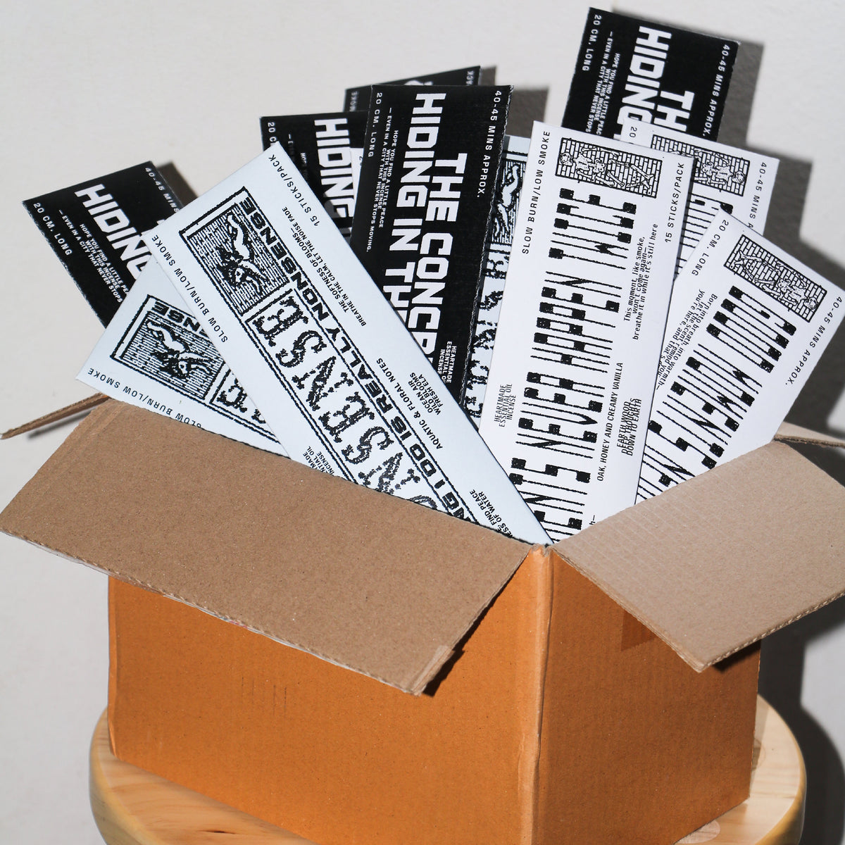 The Concrete Demon long stick incense packs in an open shipping box | Bong Warehouse