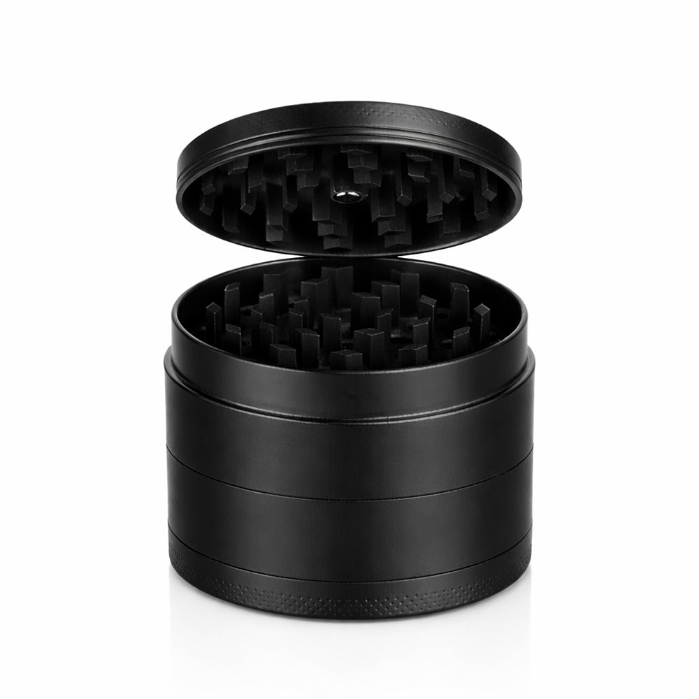 Black round metal weed and herb grinder with the lid lifted off | Bong Warehouse