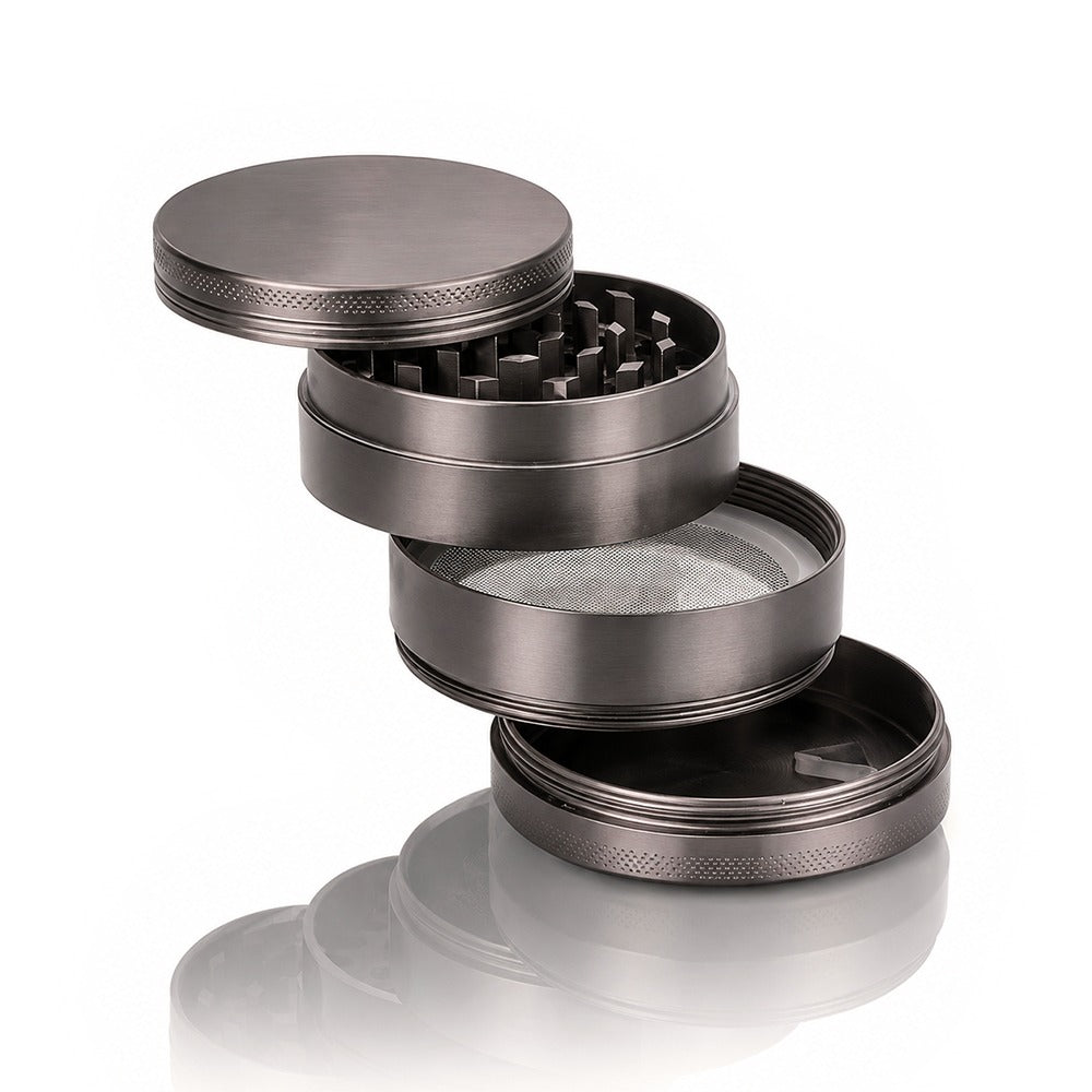 Four layers of the gunmetal grey metal weed grinder from Bong Warehouse: lid, teeth, mesh screen and pollen catcher
