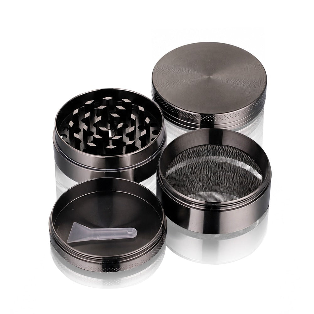 Gunmetal grey metal weed grinder from Bong Warehouse in four parts with the clear pollen scraper in the base