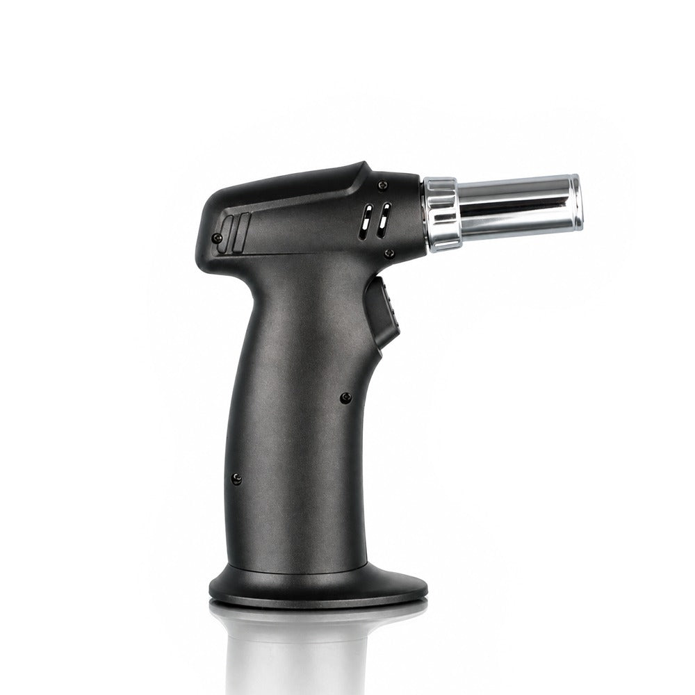 Black pistol grip single jet torch lighter on a weighted base, side view | Bong Warehouse