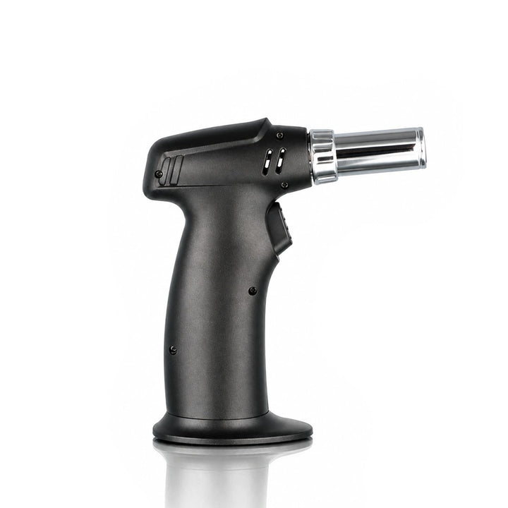 Black pistol grip single jet torch lighter on a weighted base, side view | Bong Warehouse