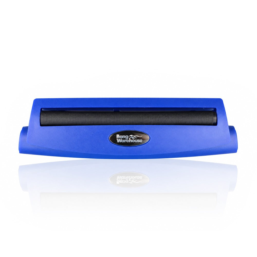 Blue king size 110mm plastic cigarette rolling machine from Bong Warehouse, front view with the black rolling apron and Bong Warehouse badge