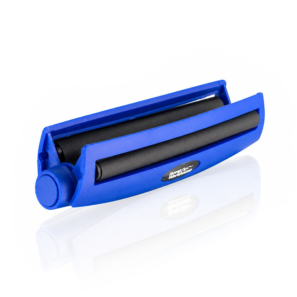 Blue king size 110mm plastic cigarette rolling machine from Bong Warehouse, shown open with the roller lid lifted and black rollers exposed