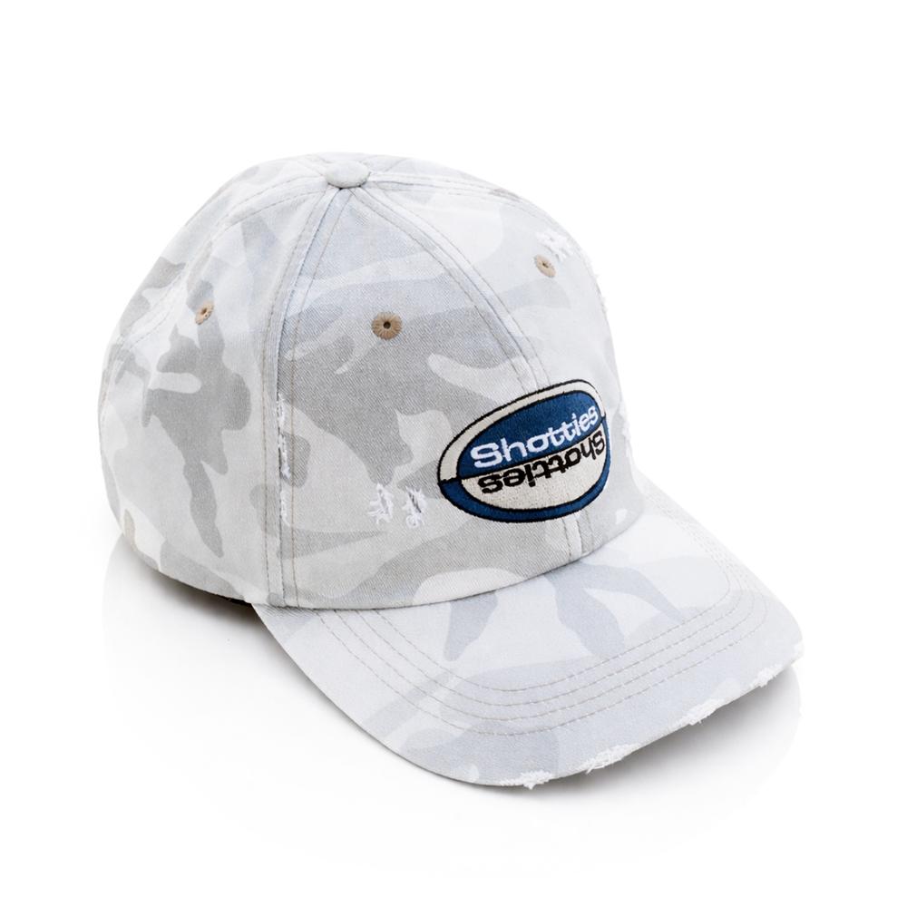 BW - Camo Shotties Hat Full Top Angled view  White camouflage baseball cap with a logo Shotties on a white background
