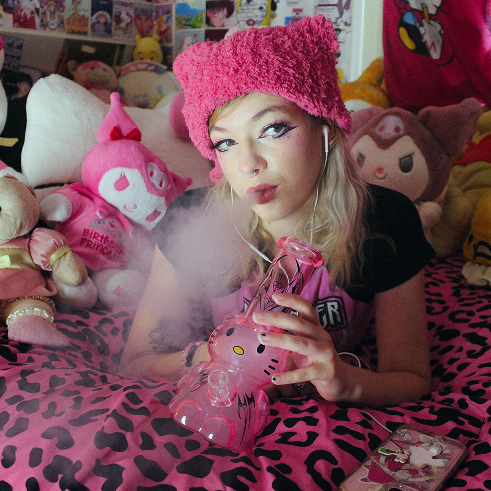 Bong Warehouse Tribal 3D Hello Kitty Bong 22cm Pink being used for smoking