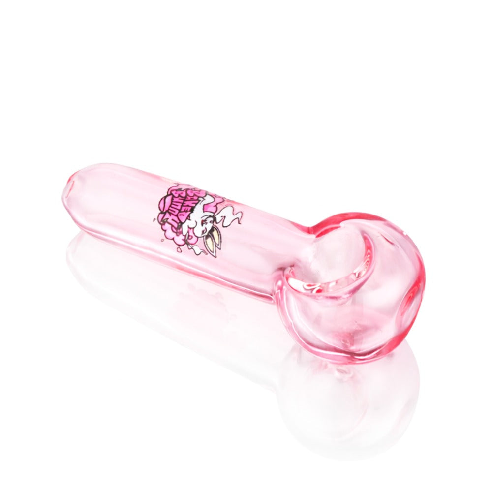Angled view of Baked Bunny Glass Pipe in Pink on white background, displaying vibrant pink glass finish