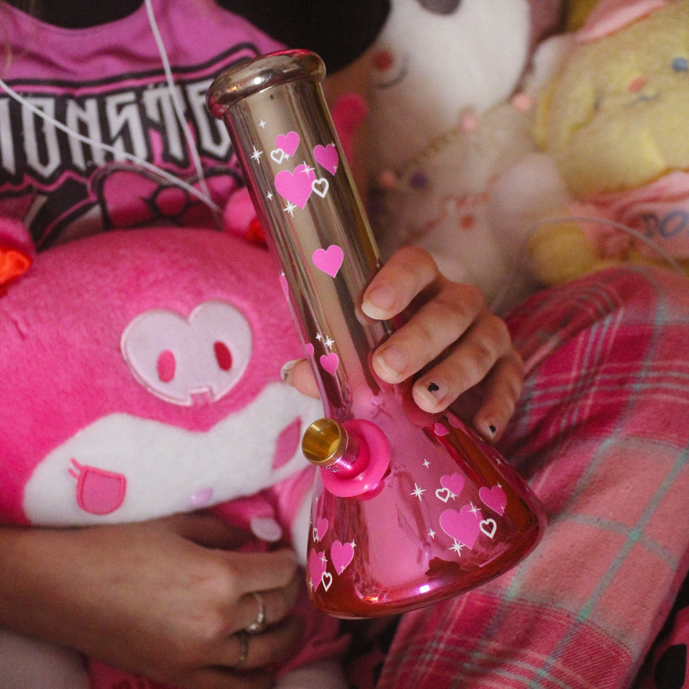 Bong Warehouse Chrome Hearts Beaker Bong 20cm in Pink held by smoker in bed