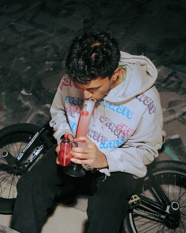 Smoking through a Bong Warehouse Double Chamber 30cm Glass Bong – Pink Cherry Bomb