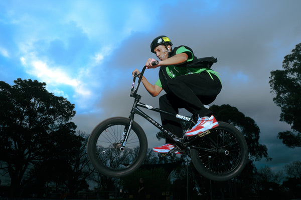 Biking with stunt moves after using Bong Warehouse Double Chamber 30cm Glass Bong – Pink Cherry Bomb