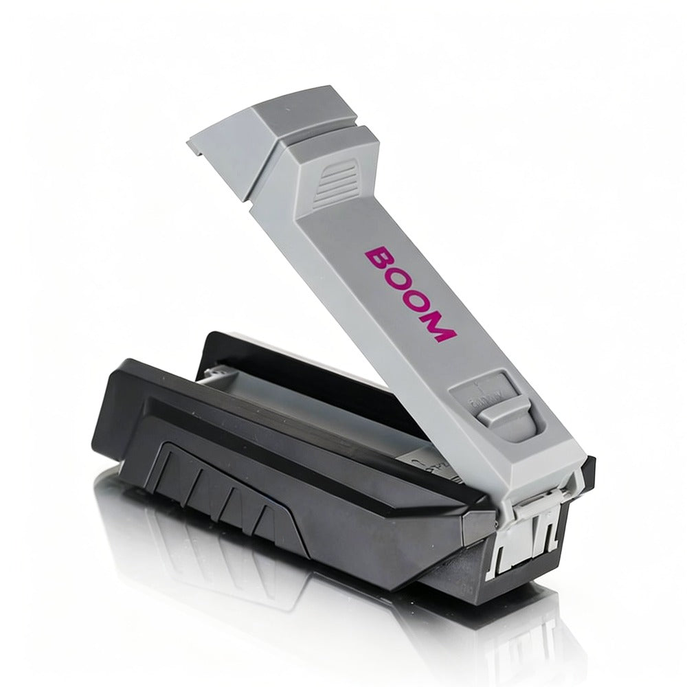 Gray and black device with 'BOOM' branding on a white background