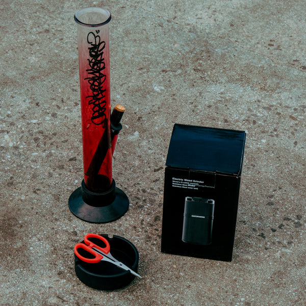 Bong Warehouse  Smoke Weed Graffiti Large Tube 33cm Glass Bong in Pink Fade Clear with scissor, ashtray, and electric grinder.