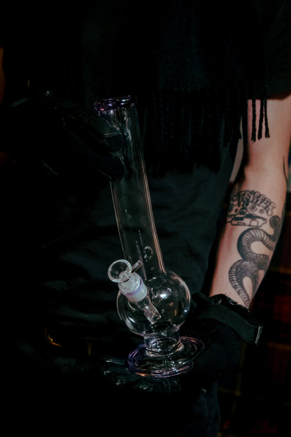 Man holding the Shotties™ - 33cm Glass Bent Bubble Bong in Clear and Purple from Bong Warehouse