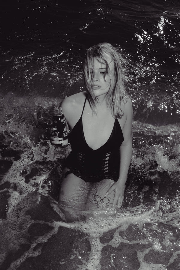 Grayscale image of woman  posing sexy and holding Bong Warehouse Black High Tiger 17.5cm Bottle Bong