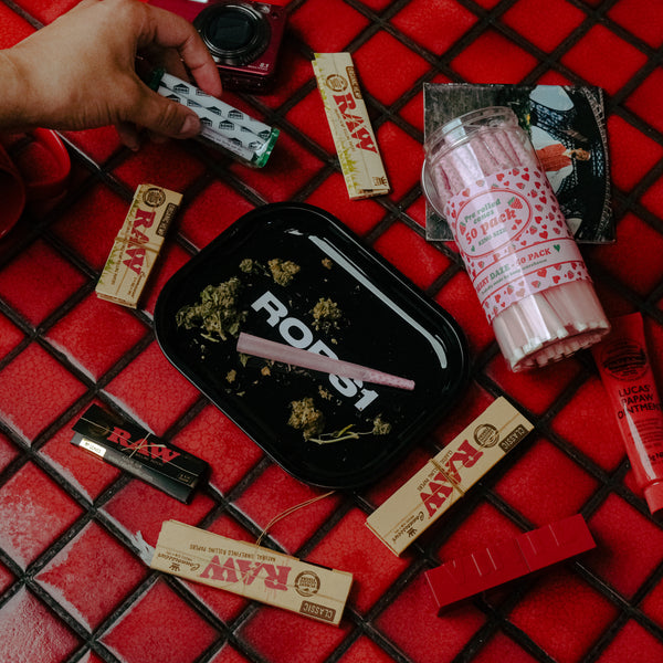 Rolling the ground weed with Bong Warehouse Rolling Papers collection