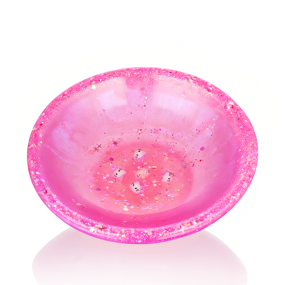 Pink Hello Kitty Chop Bowl with a reflective surface on a white background