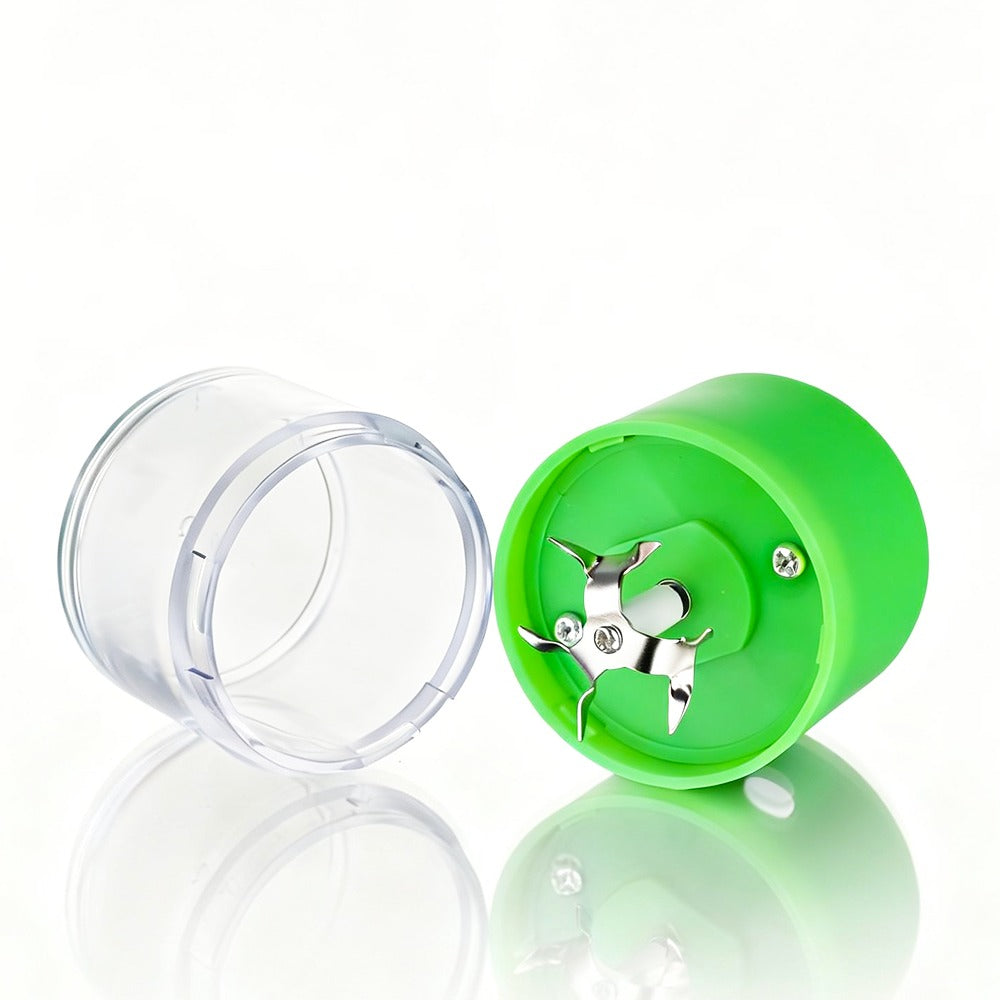 Green Green cannabis grinder with cannabis buds and clear container on a white background on a white background on a white background