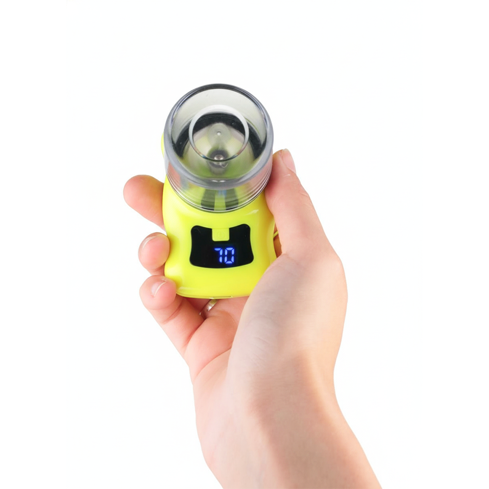 Hand holding a yellow digital grinder with digital display on a white background