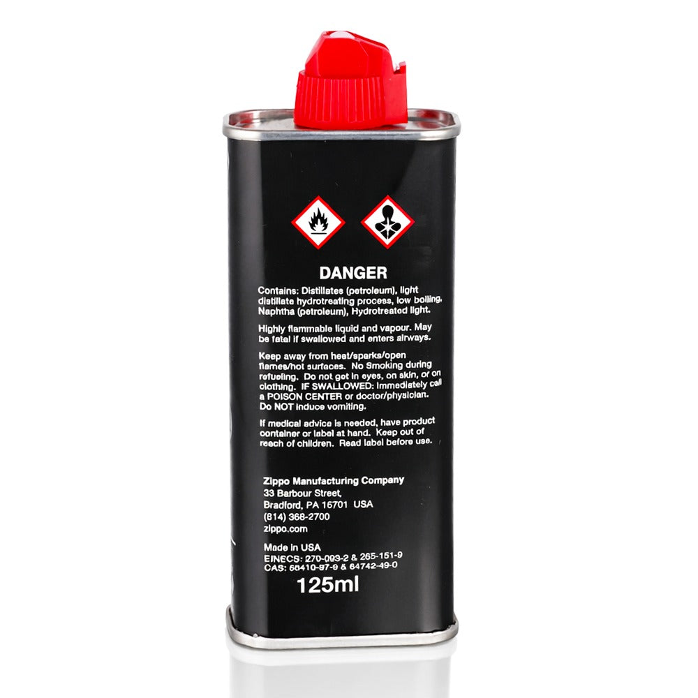 Zippo lighter fluid can with red cap on a white background