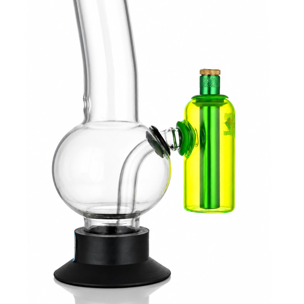 Neon green tube ash catcher fitted to a glass bong, angled view