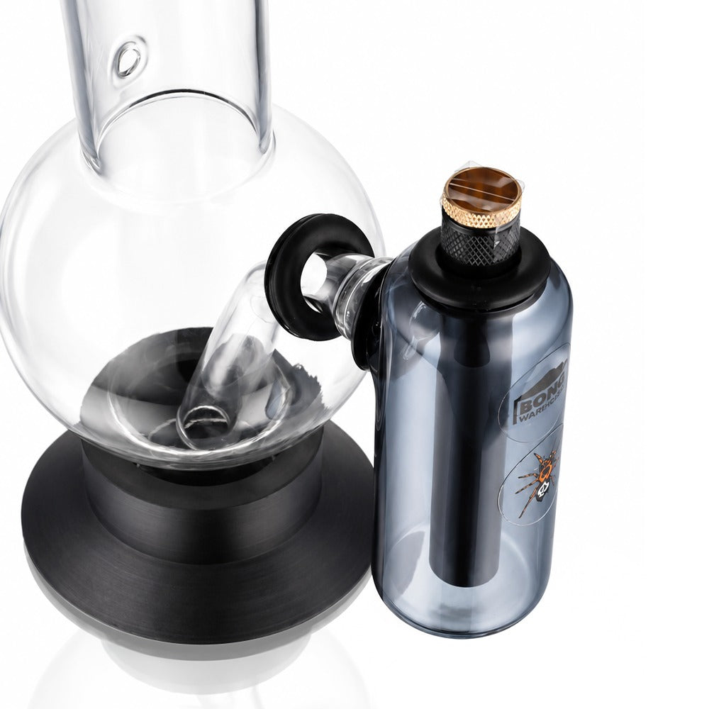 Neon grey tube ash catcher fitted to a glass bong, angled view