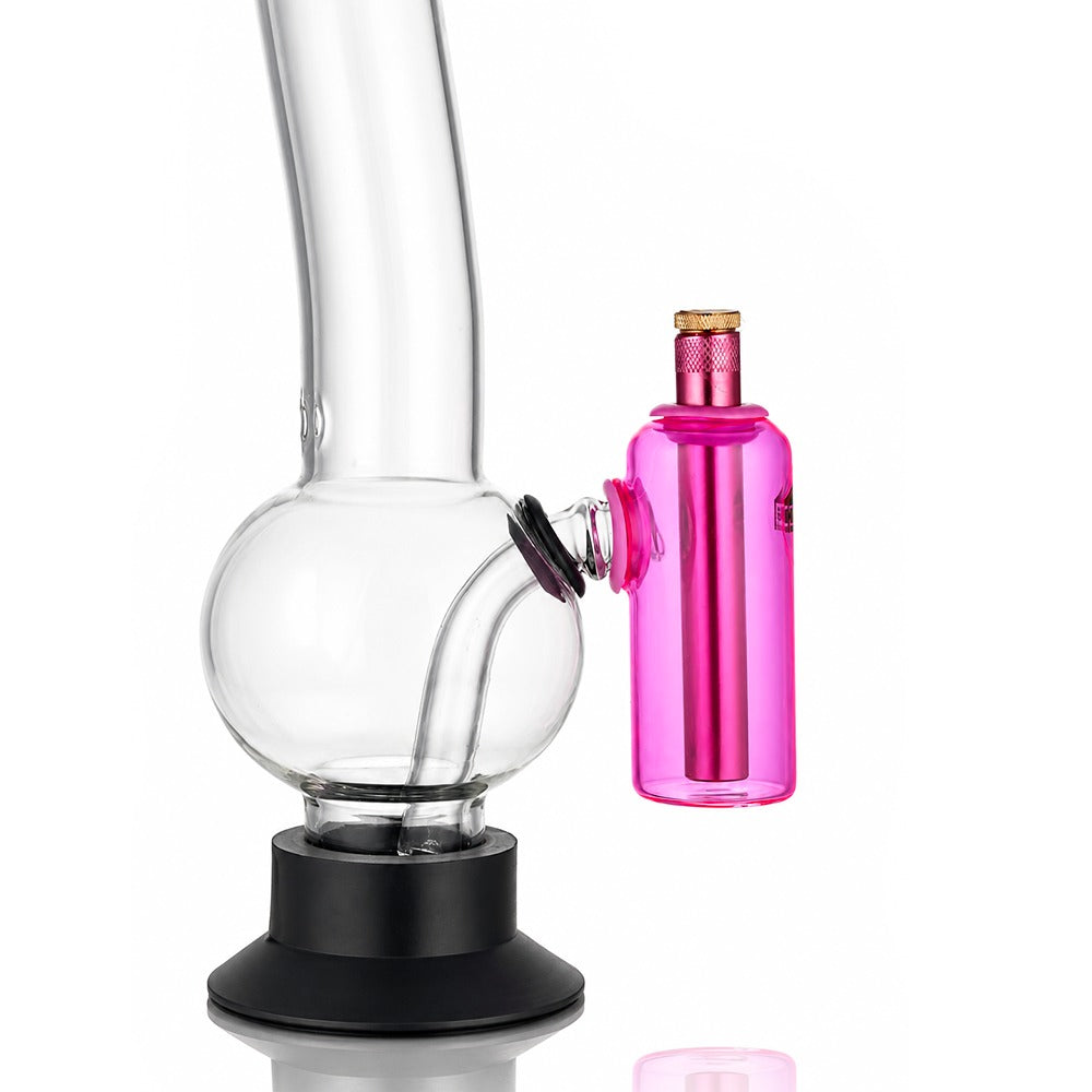 Pink tube ash catcher fitted to a glass bong, angled view