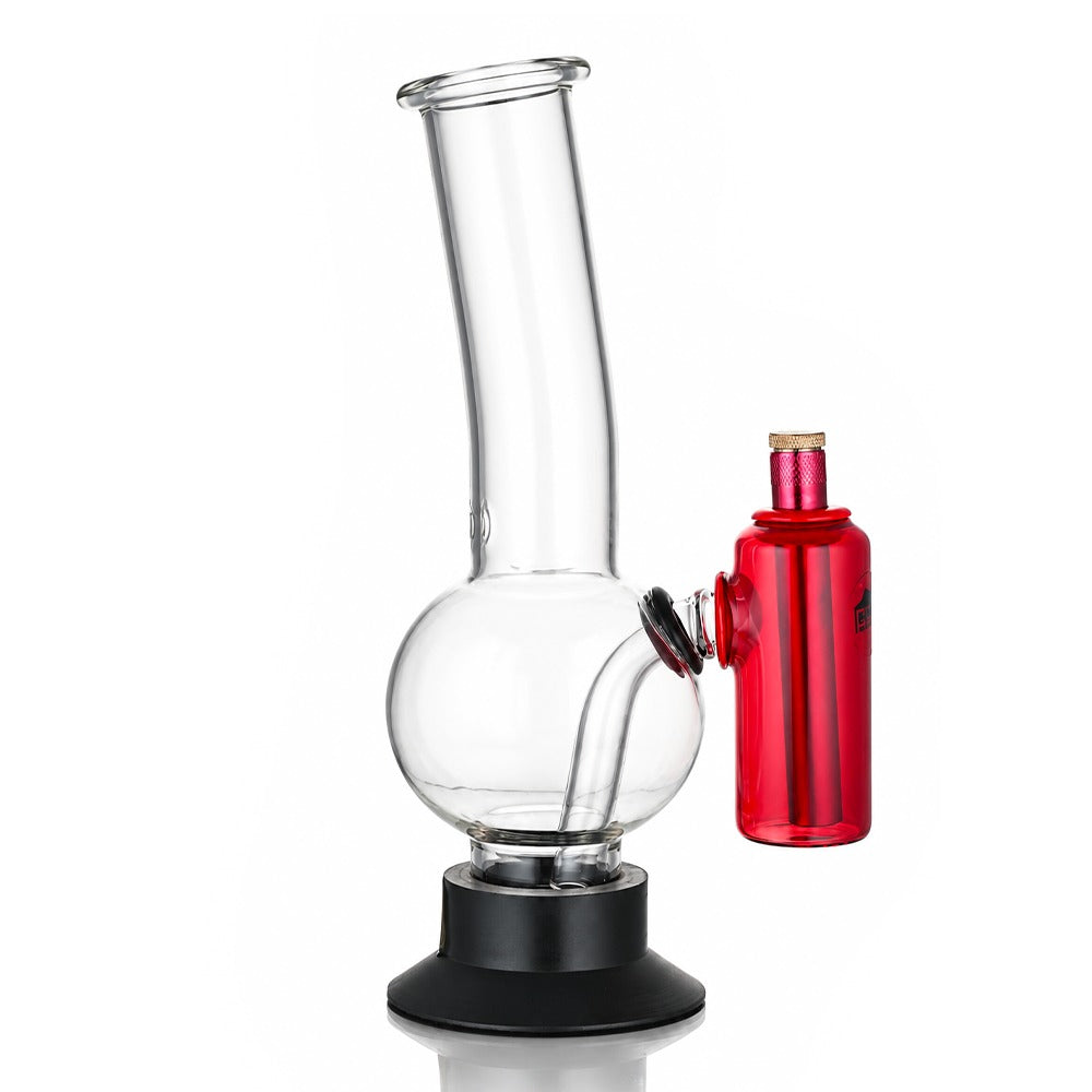 Red tube ash catcher fitted to a glass bong, angled view